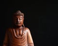 Buddha portrait against dark background