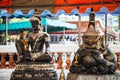 Buddha and Rahu sculptures at Buddhist shrine