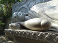 Buddha resting in the garden of the Asian temple.