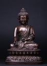 Buddha`s figure, made of metal in a meditation pose Royalty Free Stock Photo