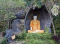 Buddha`s statue in orange clothes Royalty Free Stock Photo