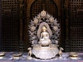 Buddha sculpture on an altar inside Hiranya Varna Mahavihar. Golden Temple. Patan, Kathmandu. Nepal