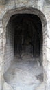 Buddha sculpture in a niche Royalty Free Stock Photo