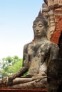 Buddha sculpture in the ruins of the historic royal temple Wat Phra Sri Sanphet. Ayutthaya, Thailand. Royalty Free Stock Photo
