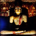 Buddha sitting in Sri Lanka dark shadow light