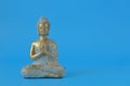 Buddha statue on a blue background.Meditation and relaxation symbol.Buddhism religion background.Buddhism religion Royalty Free Stock Photo