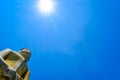 Buddha statue on blue sky background