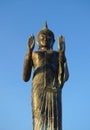 Buddha statue with blue sky at Khun Samut Trawat temple Thailand