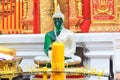 Buddha statue with candle