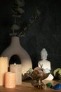 Buddha statue, candles and gemstones. Balance energy flow, purifying air, decrease stress Royalty Free Stock Photo