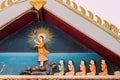 Buddha statue with disciple in temple