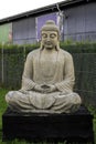 Buddha statue figure sculpture in stone outside