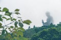 Buddha statue in the fog