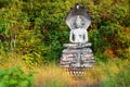 Buddha statue in the forest of Phu Salao temple at Pakse, Laos