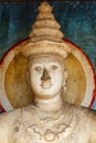 Buddha statue inside of Ruvanvelisaya Dagoba, a cetiya or stupa in the sacred city of Anuradhapura, Sri Lanka