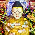 Buddha Statue with Money Offerings at Mount Popa, Myanmar