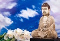 Buddha statue with orchid flower Royalty Free Stock Photo