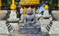 Buddha statue with red color on his forehead on the square near Swayambhunath stupa