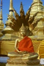 Buddha statue in red at Wat Boromthat temple in Tak, Thailand.