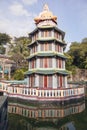 Buddha Statue Sitting on Top of Pagoda Royalty Free Stock Photo