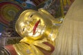 Buddha statue in sleeping style, gold buddha statue Royalty Free Stock Photo