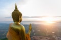 Buddha statue with sunrise and Pa Sak Jolasid Dam