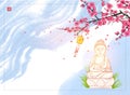 Buddha statue under the blooming sakura tree on blue sky background. Translation of hieroglyph - zen Royalty Free Stock Photo