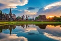 Buddha statue and Wat Mahathat Temple in the precinct of Sukhothai Historical Park Royalty Free Stock Photo