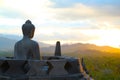 Buddha Statue Watching the Sunset Over Borobodur Temple Royalty Free Stock Photo