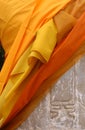 Buddha Statue Wrapped in Orange Fabric