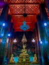 Buddha statues with mural painting around. Royalty Free Stock Photo