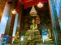 Buddha statues with mural painting around. Royalty Free Stock Photo