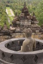 Buddha statues overlooking surroundings at Borobudur temple at sunrise in Java Indonesia Royalty Free Stock Photo