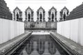 Buddha statues with pavement and white wall, Black and white background