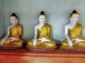 Buddha statues in a temple gallery in Burma