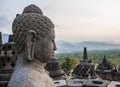 Buddha statues at the top of Borobudur Temple in Indonesia. The island of Java. Royalty Free Stock Photo