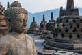 Buddha statues at the top of Borobudur Temple in Indonesia. The island of Java. Royalty Free Stock Photo