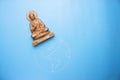 Buddha statuette on the earth Royalty Free Stock Photo
