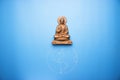 Buddha statuette on the earth Royalty Free Stock Photo