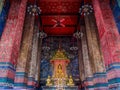 Buddha statute sit in the Throne with big columns in lines. Royalty Free Stock Photo