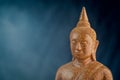 Buddha stone sculpture close-up black background macro