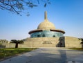 Buddha stupa with bright blue sky at morning from low angle