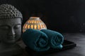 Buddha witn candle and towel spa concept Royalty Free Stock Photo