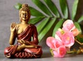 Buddha in ZEN garden with flower Royalty Free Stock Photo