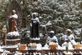 Buddhas under the snow in Okunoin Cemetery, Koyasan area in the mount Koya region, UNESCO World Heritage area, Wakayama Prefecture