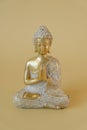 Buddhism background.Buddha golden statue on beige background.Beautiful Buddhism background in golden colors. Meditation