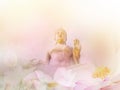 Golden Buddha statues and floral abstract pink blossom water lily with pastel vintage soft style Royalty Free Stock Photo