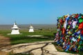 Buddhism prayer flags and stupa in steppe