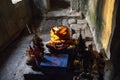 Buddhist altar with ancient stone Buddha statue. Ancient Buddha statue in Ta Prohm temple