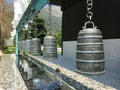Buddhist bronze bells over water